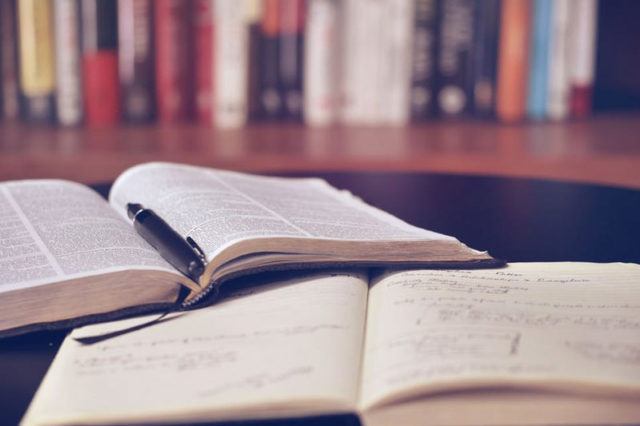 two open textbooks in a library