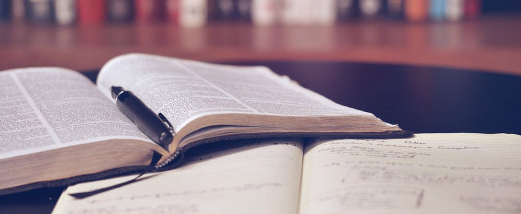 two open textbooks in a library